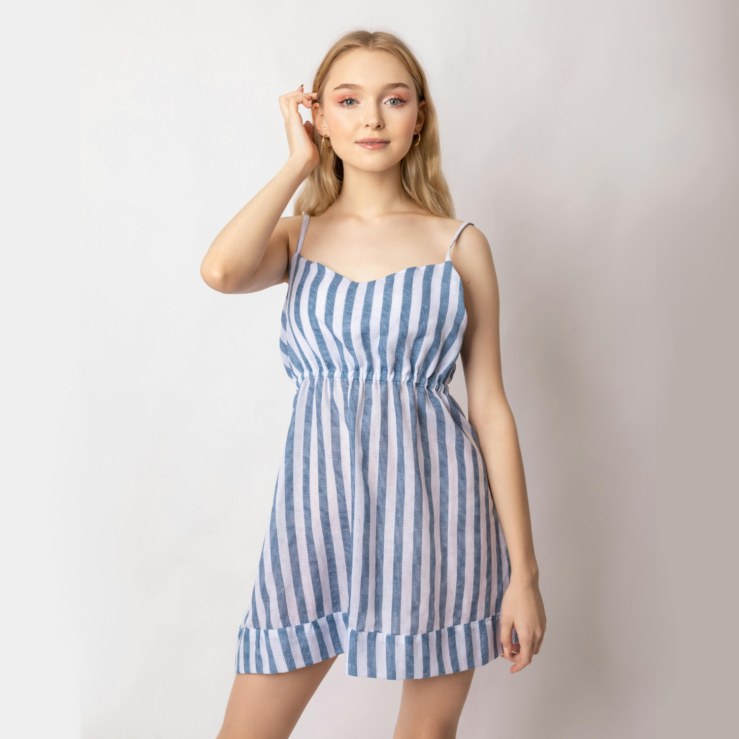 Woman posing in striped dress